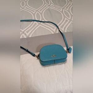 Coach Blue Crossbody Bag dimensions 7 W x 5 H x 2 D with adjustable strap.